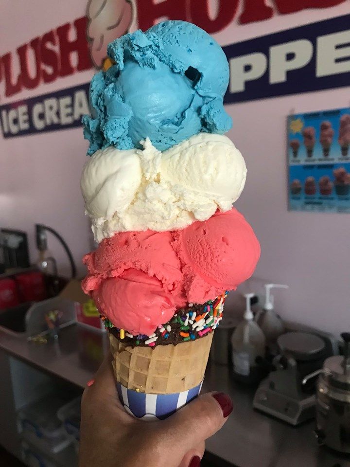 A cone with three scoops of ice cream